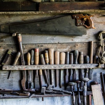 tools hung up in a woodworking shed